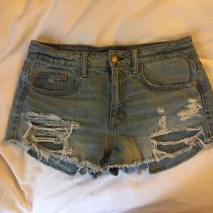 Distressed blue jean shorts